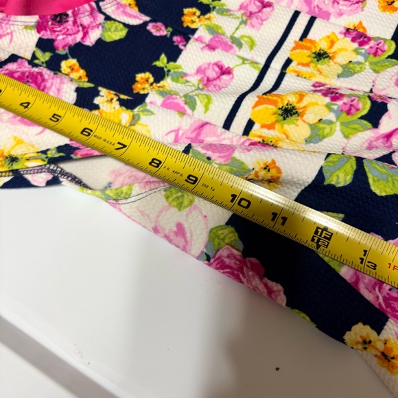 Emma & Michele floral cap-sleeve dress on a navy blue/white striped background. - Picture 11 of 12